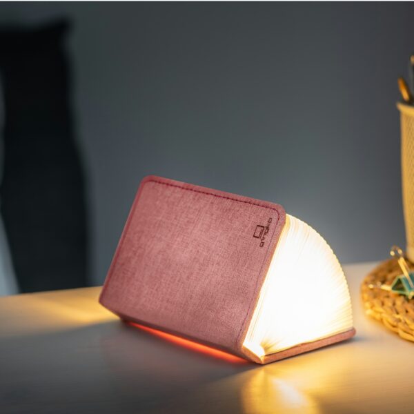 Gingko smart mini book light in pink part opened on table