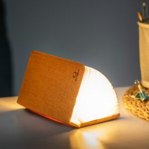 Gingko smart mini book light in orange part opened on table