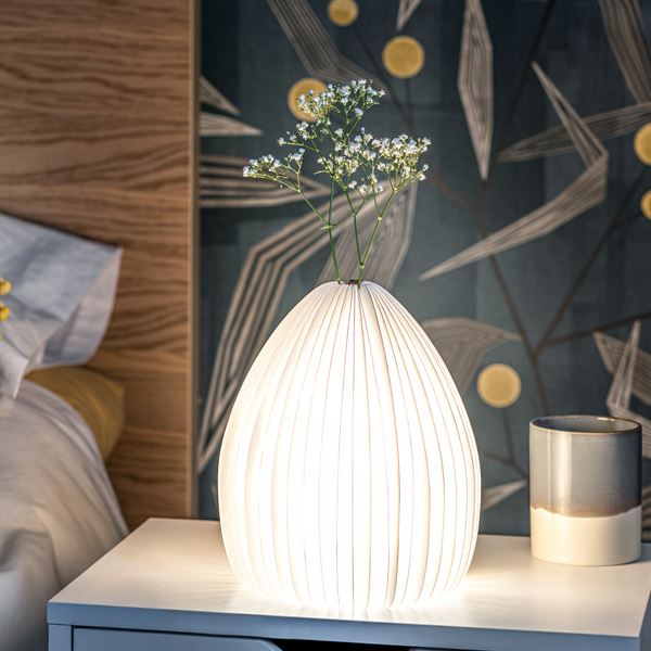 Smart Vase Light lit in bedroom with white flowers