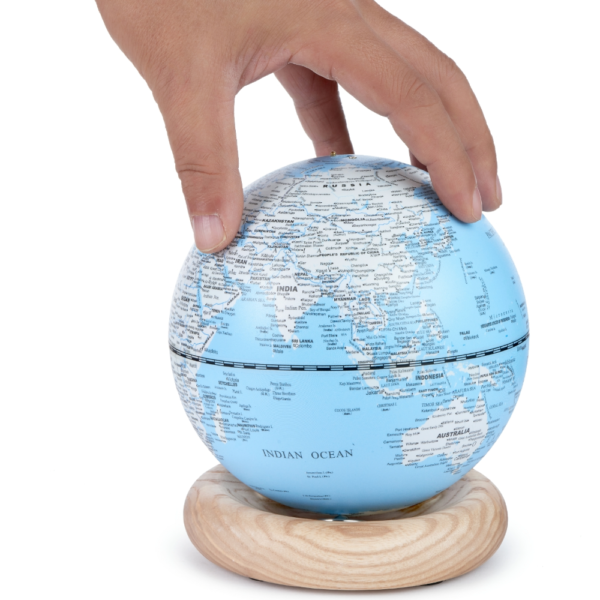 Gingko Mini Light Blue Atlas Globe with White Ash hand for proportion